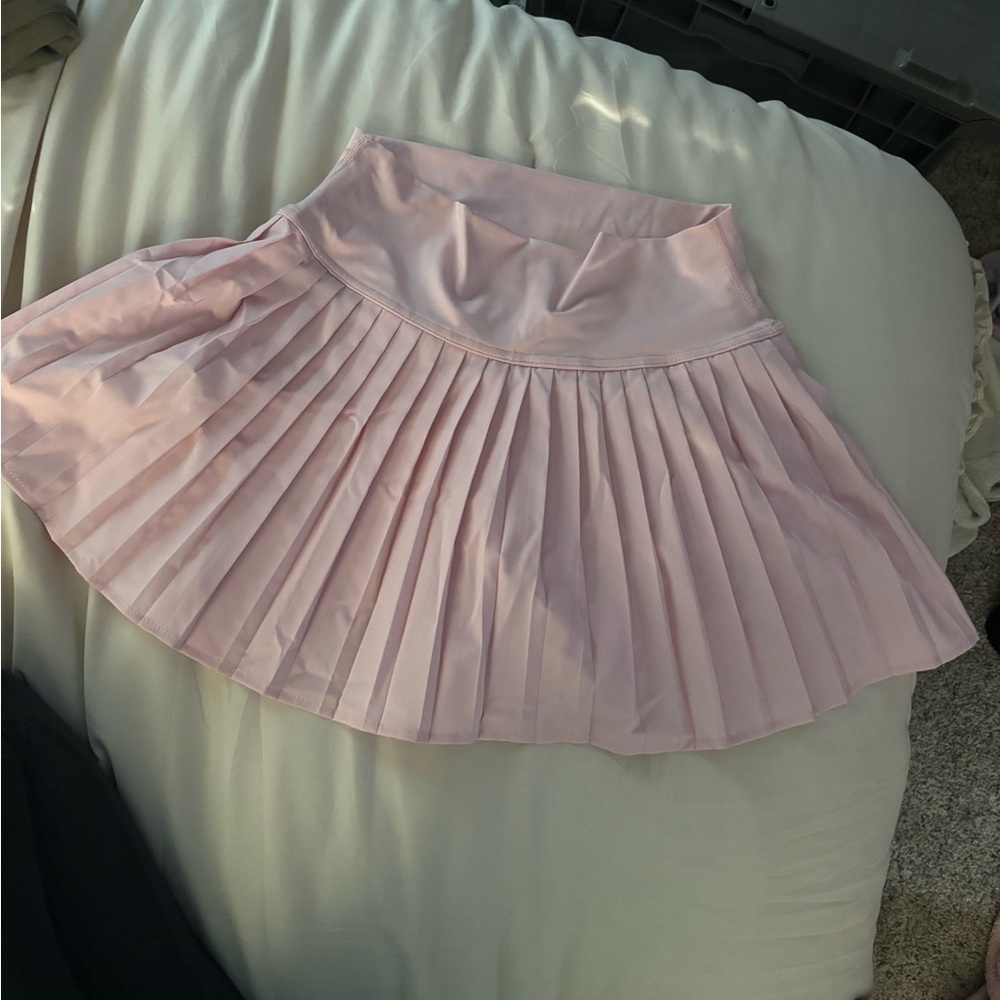 Light pink athletic skirt. NEVER WORN!!